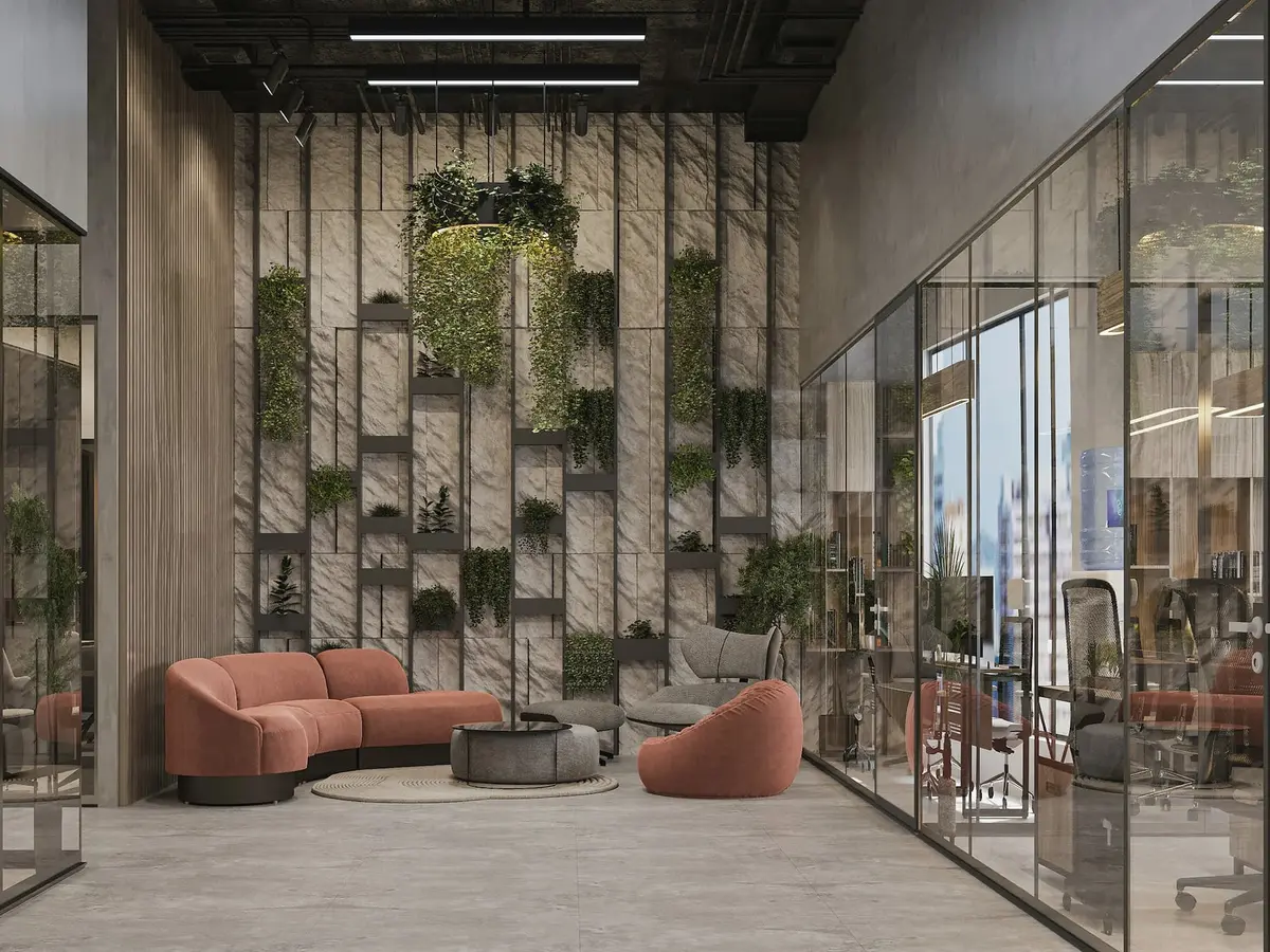 A tall entrance hall with a wall of planted steel shelves, a curved terracotta sofa and chairs, and glass-walled rooms on the right.